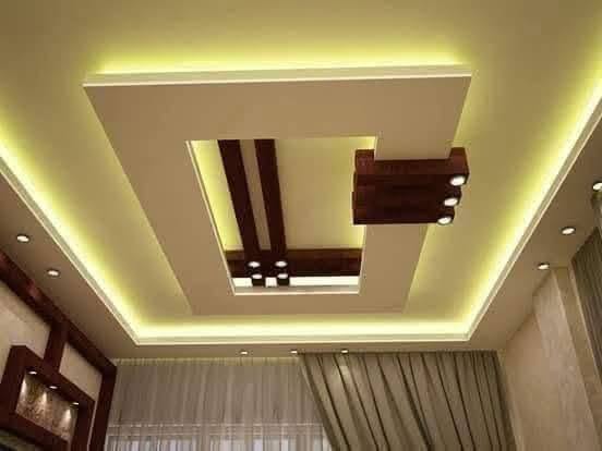 Modern Living Room with Layered False Ceiling and Ambient Lighting