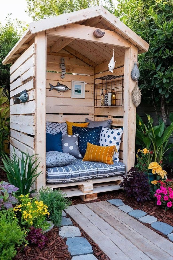 Cozy Backyard Wooden Pallet Shed Retreat with Colorful Cushions