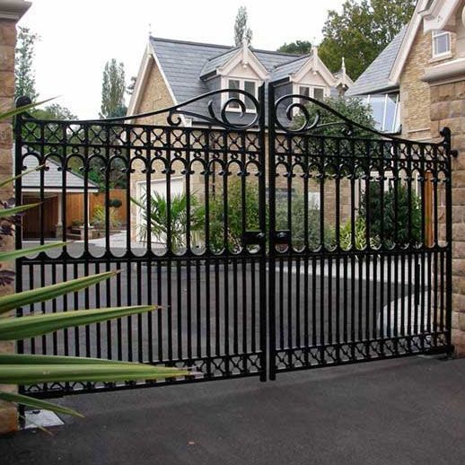 Decorative Black Wrought Iron Driveway Gate with Stone Pillars