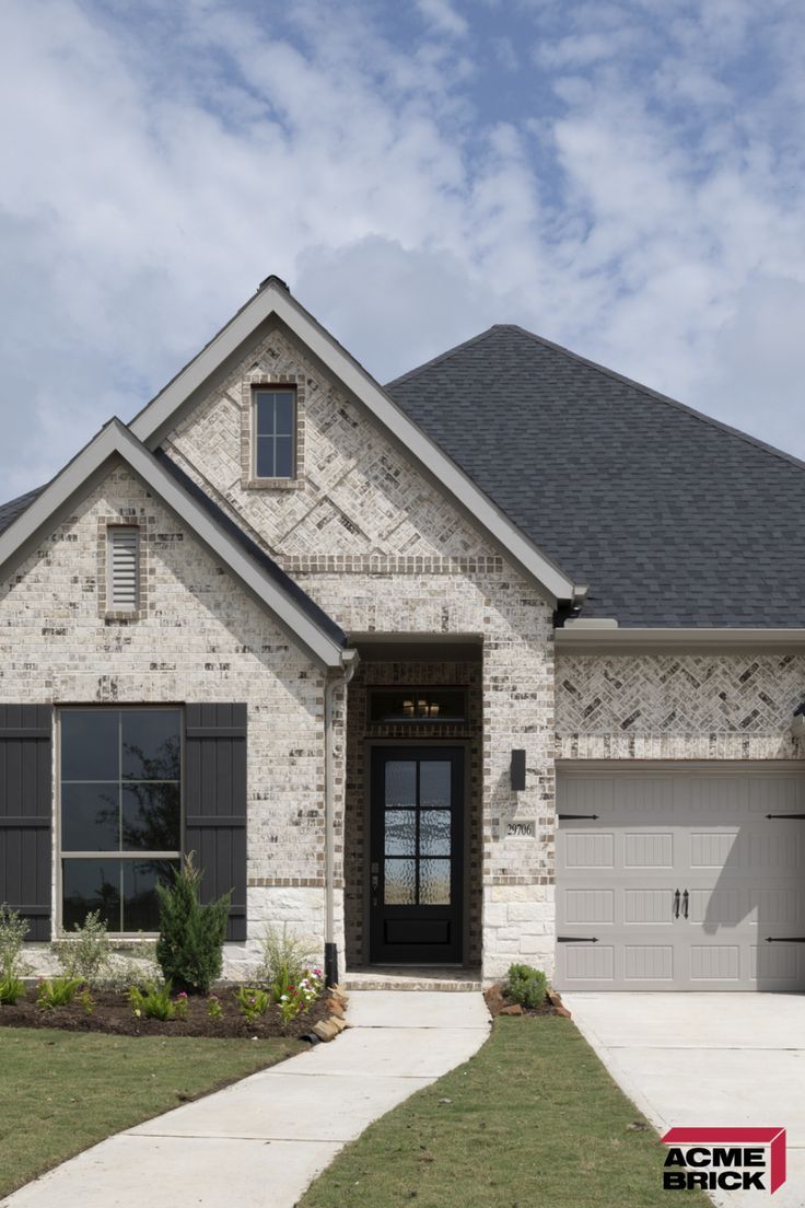 Light Brick Modern Home Exterior with Black Accents and Gable Roof