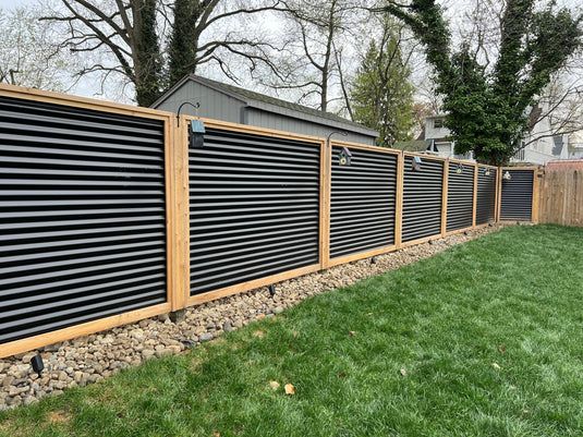 Modern Corrugated Metal and Wood Privacy Fence in Backyard Setting