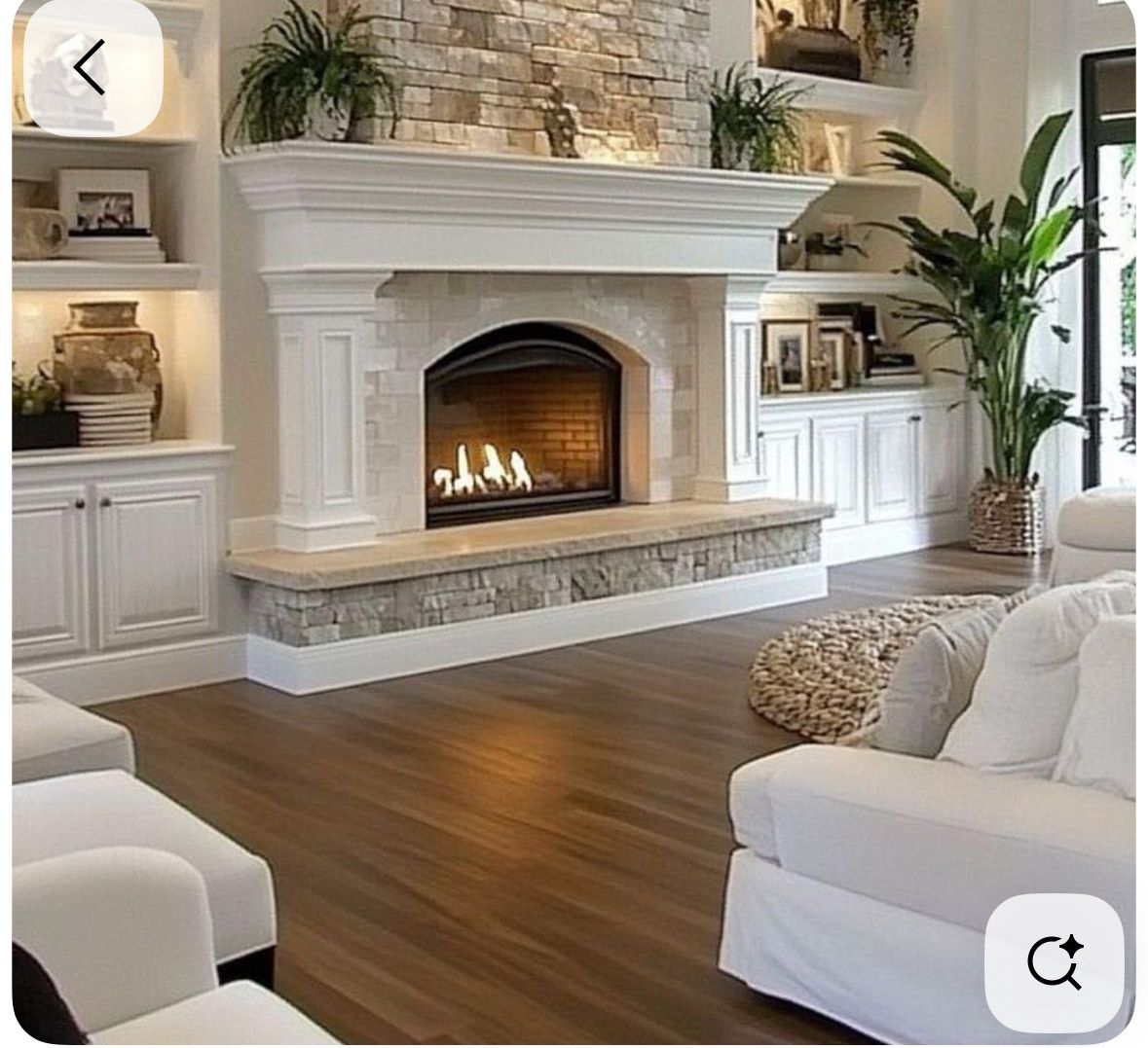 Transitional Living Room with Stone Fireplace and Built-In Shelving