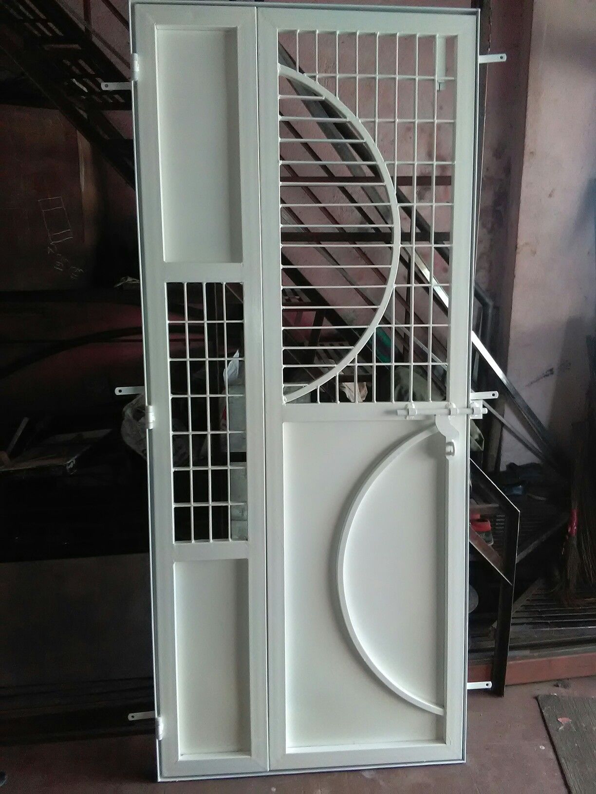Modern White Steel Security Door with Geometric Grille Design
